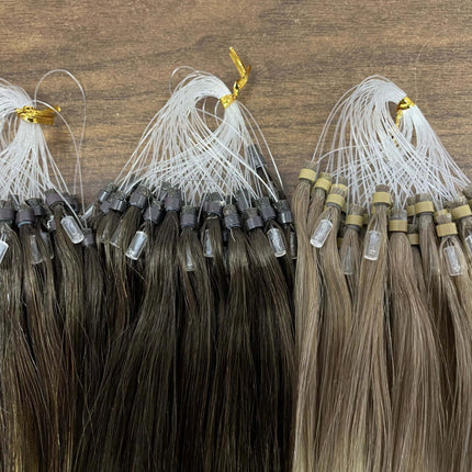 Extensions capillaires aux anneaux en cheveux naturels brun et blond pour un look élégant