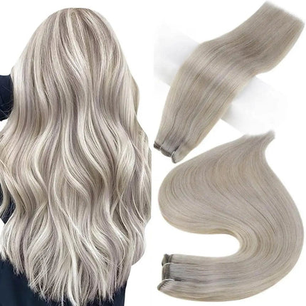 Extension longue lisse en cheveux naturels couleur blond cendré pour un look élégant et soyeux.