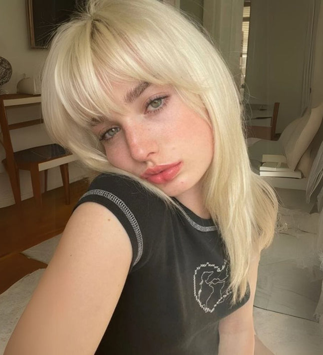 Postiche à clip blond naturel pour ajouter une frange chic et tendance à vos cheveux